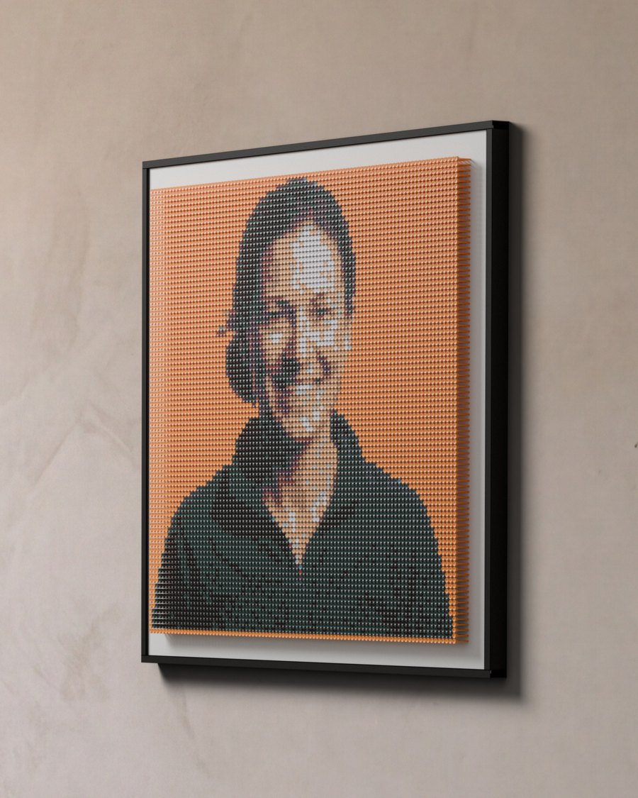 A golfer's portrait: 7,920 tees in 11 colours on an orange board, 45 by 44 inches